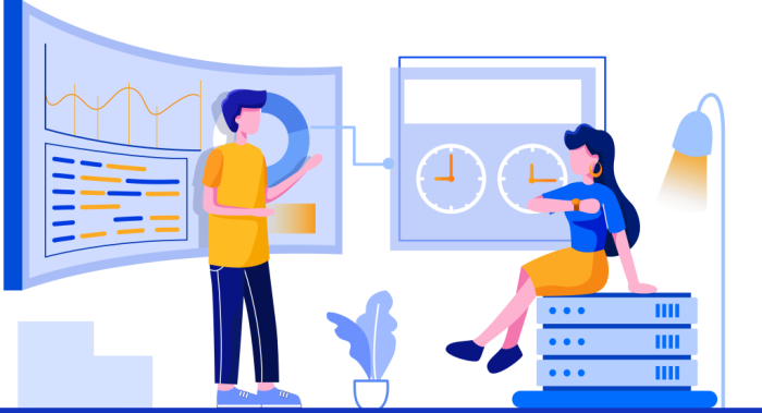 A man and woman sitting at a desk, providing digital marketing services.