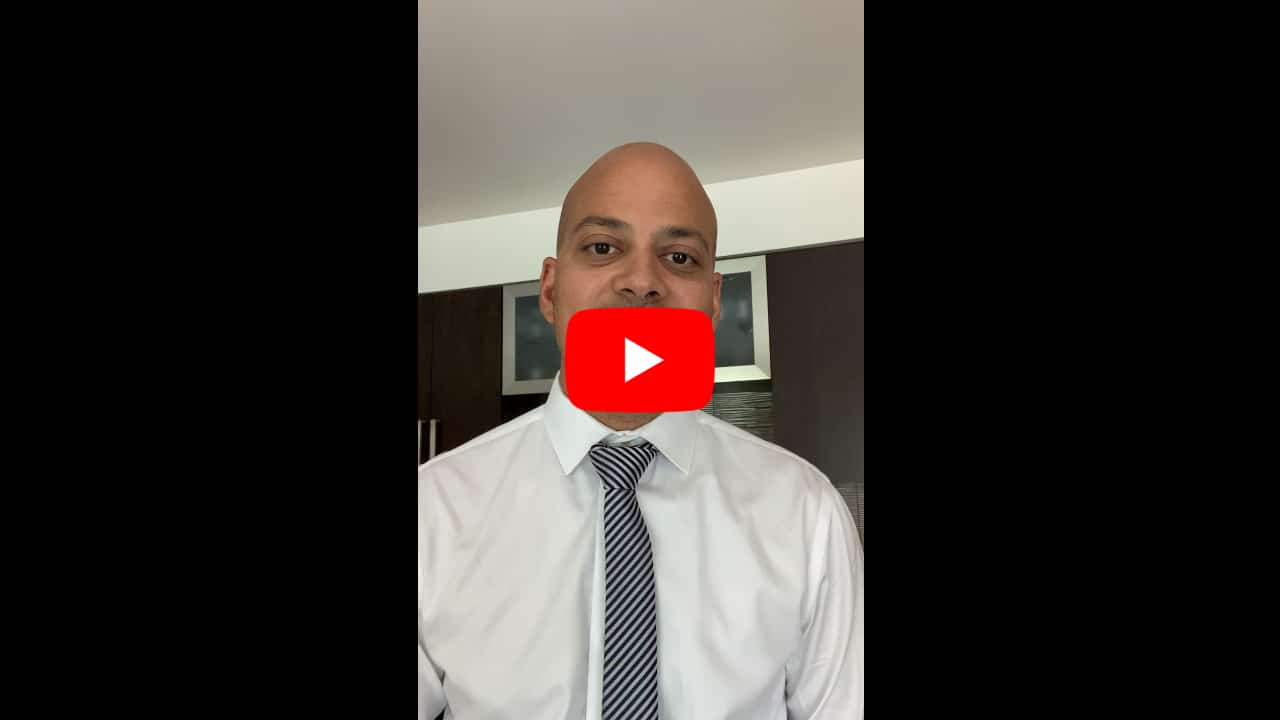 A man in a white shirt and tie is standing in front of a kitchen, displaying sample ad creatives.
