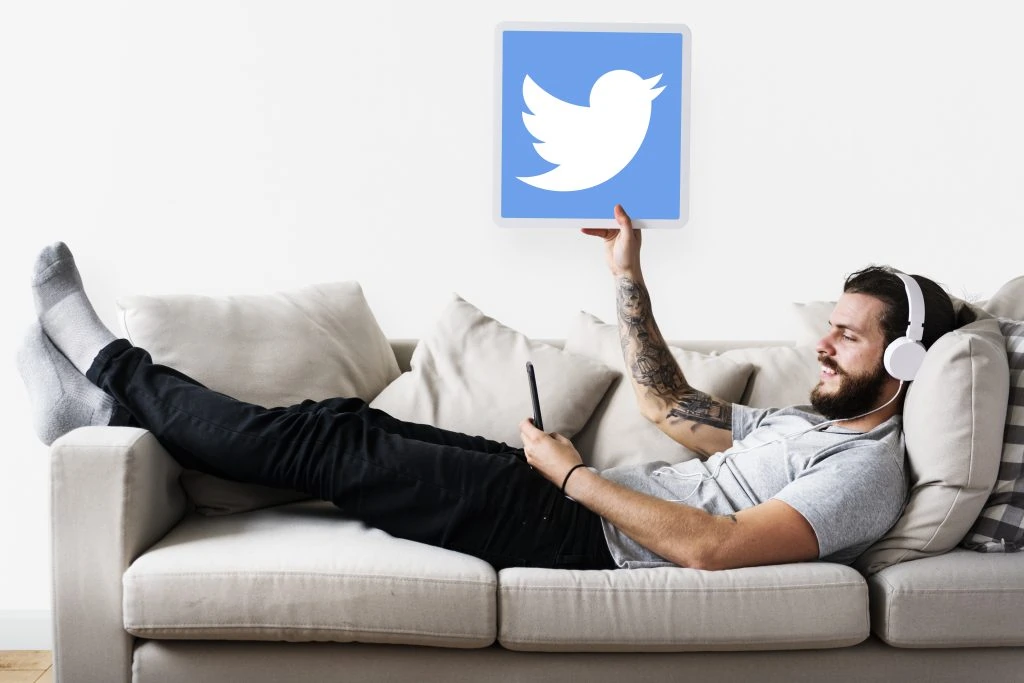 man showing twitter icon