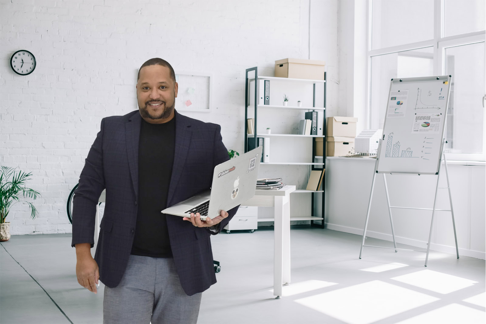 Preston holding a laptop