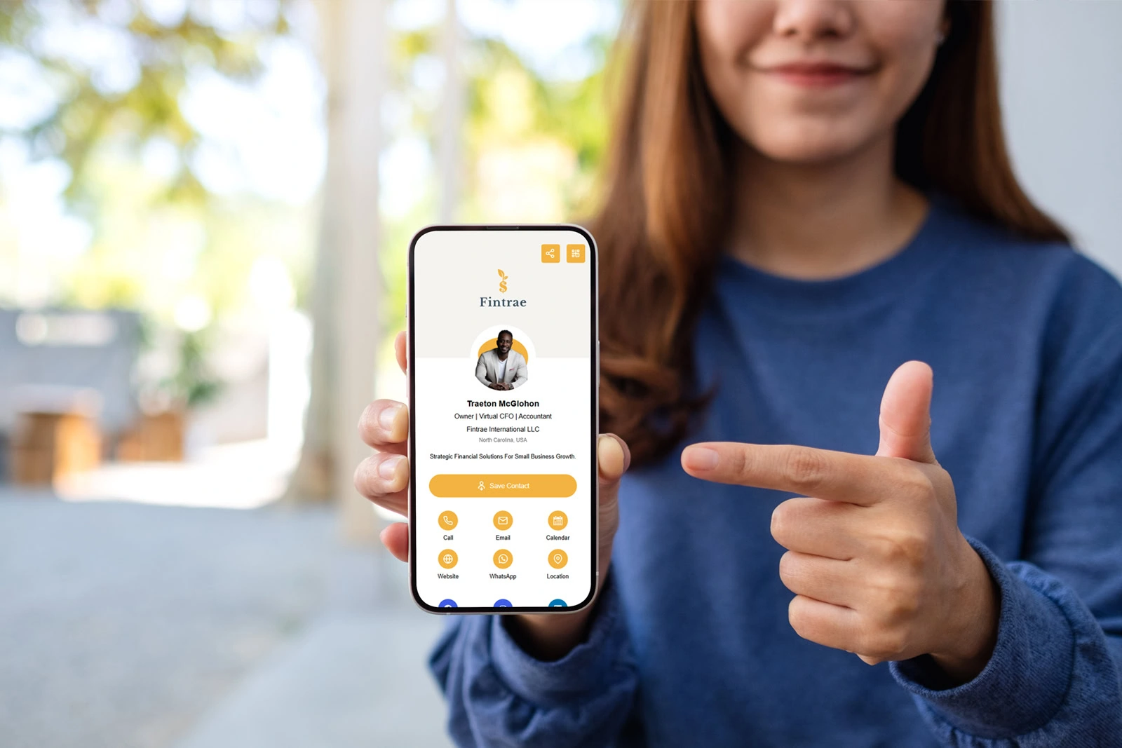 a young asian woman holding and pointing finger at mobile